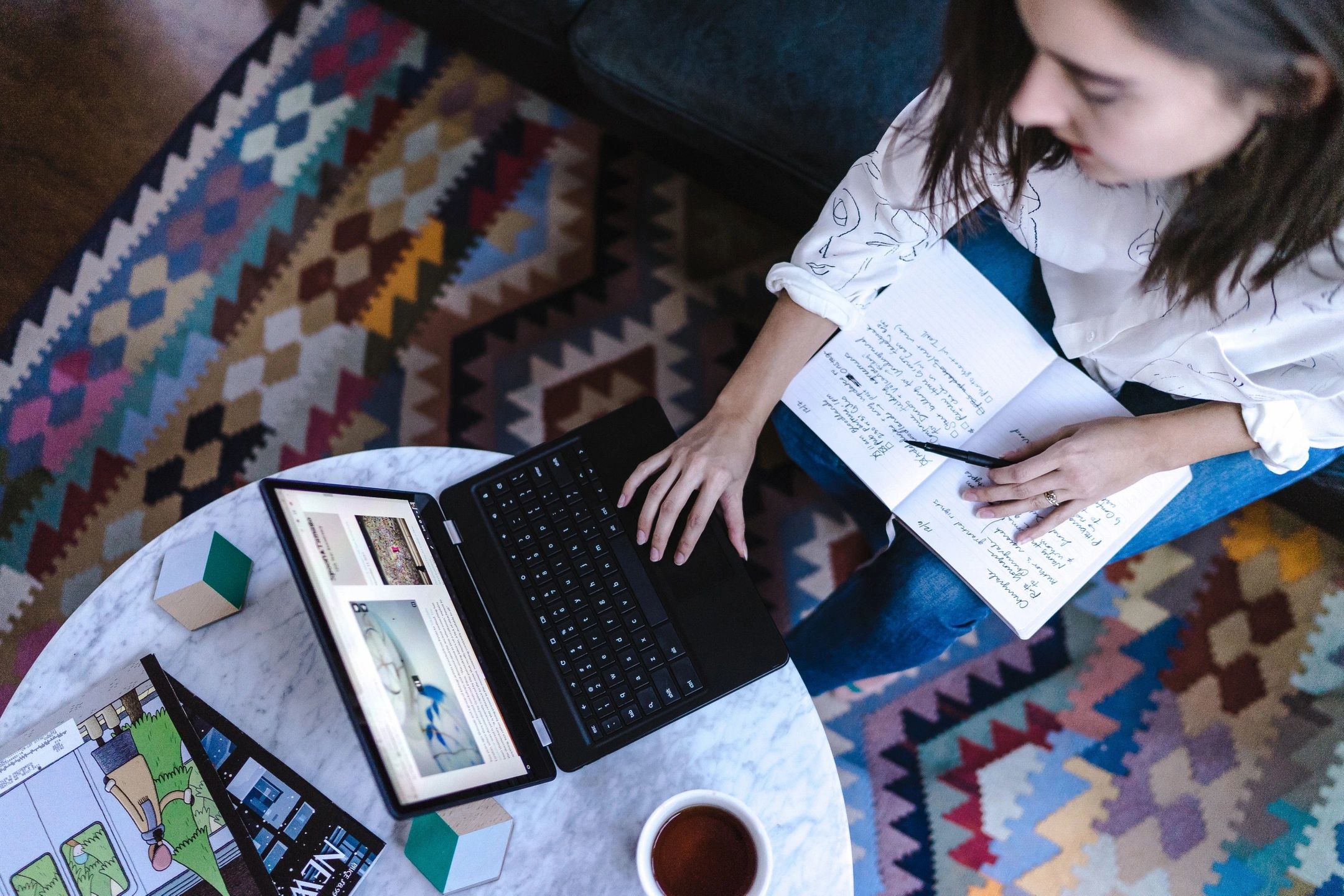 woman with notepad and laptop