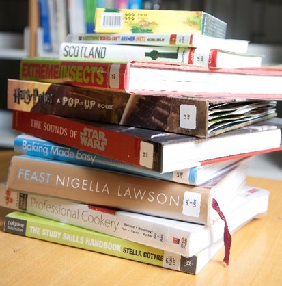 Pile of books on a desk