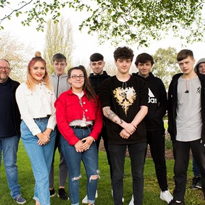 A group of students standing in gardens