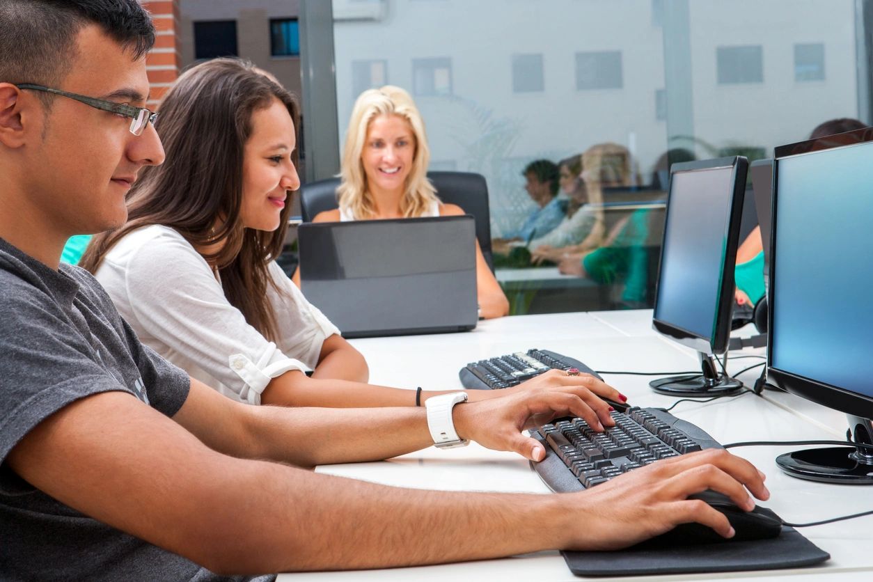 People using PCs at desks