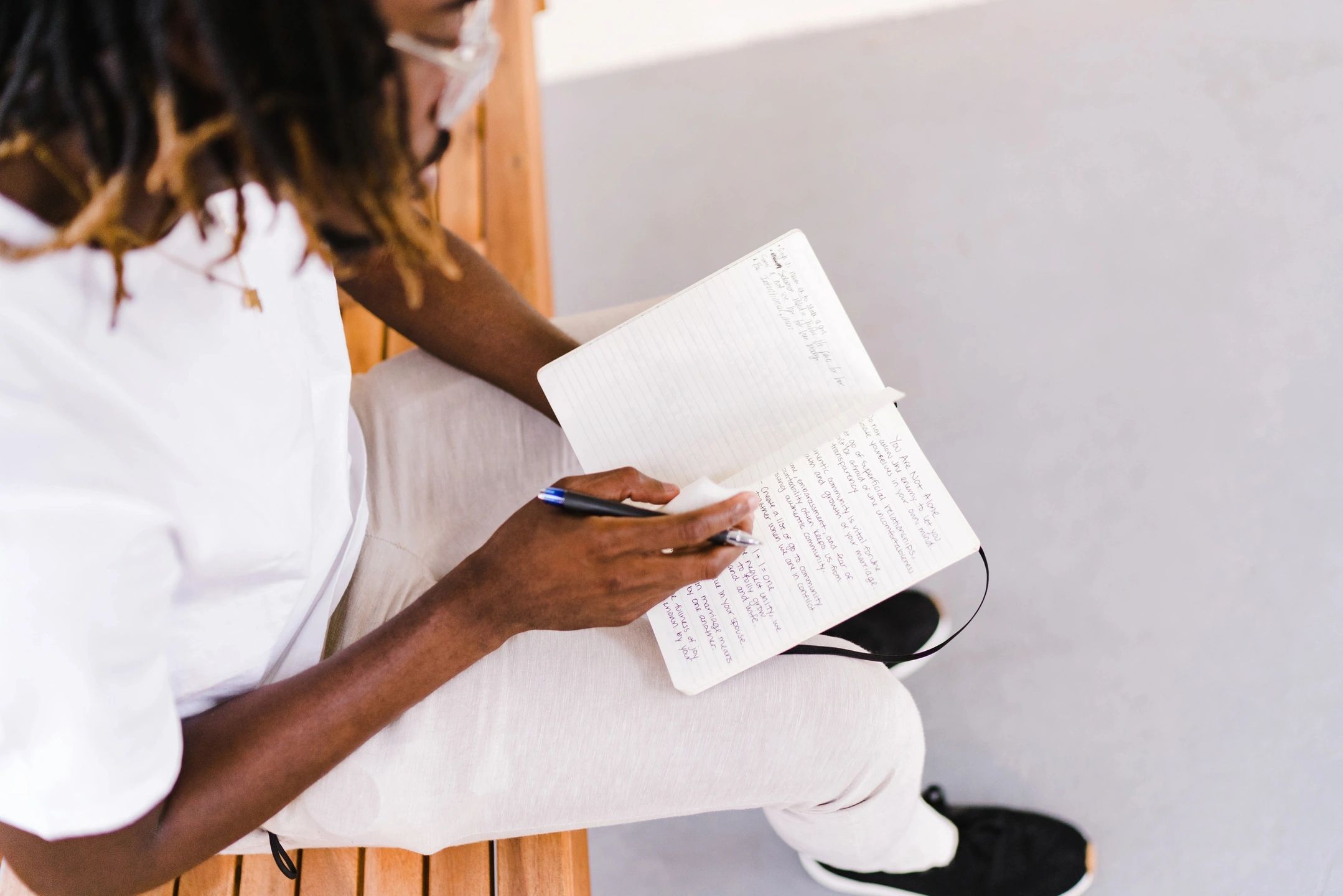 Man writing notes in a notebook